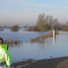 EA worker observing flooded road