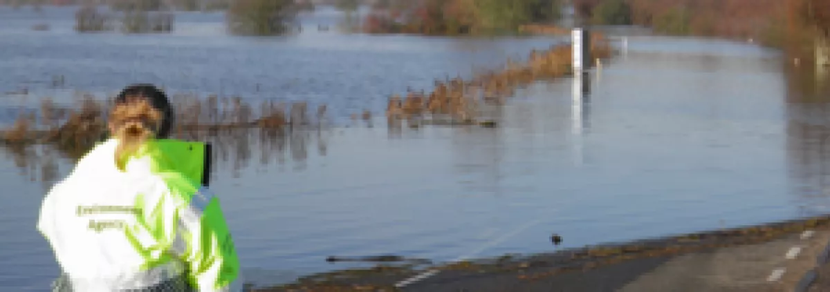 EA worker observing flooded road